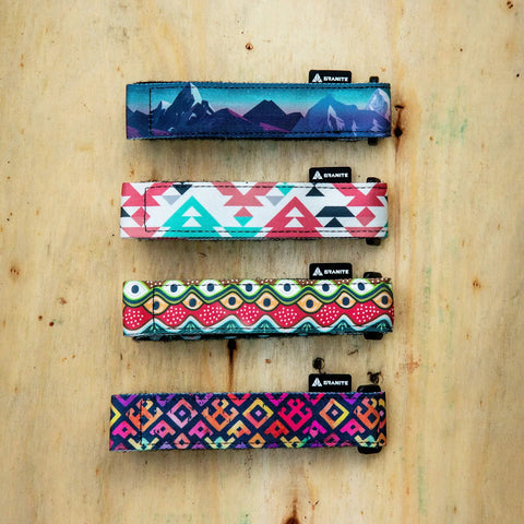 Rockband Frame Carrying Strap For Inner Tubes And Bike Tools, straps in four colorful designs on wooden background