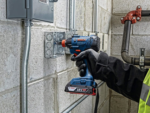 Worker using Two-In-One 18V Impact Driver Kit With 1/4 Inch Quick-Change Hex And 1/2 Inch Drive, Delivers Up To 1,600 In-Lbs Torque, Variable Speed Trigger, No Socket Adapters Needed, Lightweight, All-Purpose Power Tool on metal junction box