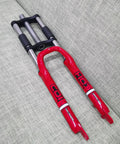 26 Inch Suspension Front Fork With One And One Eighth Inch Headset Disc Brake Ready Aluminum Triple Tree Red on sofa