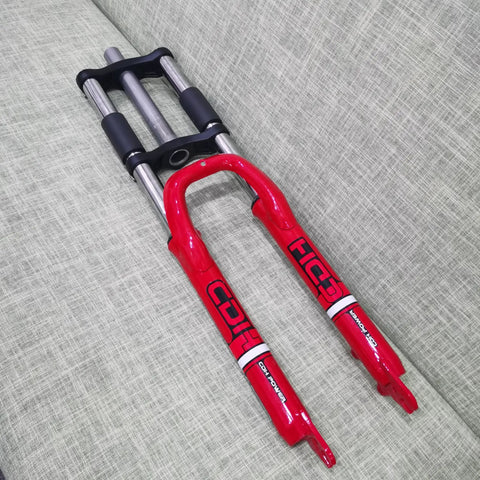 26 Inch Suspension Front Fork With One And One Eighth Inch Headset Disc Brake Ready Aluminum Triple Tree Red on sofa