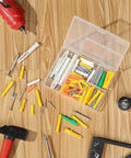 Drywall Anchors And Screws Kit With 100 Pieces on wooden floor with tools, includes 50 plastic wall anchors and 50 metal screws.