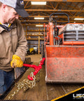 Man using Badass Heavy Duty Lever Load Binder For 516 Inch Grade 70 Chain With 5400 Lbs Working Load Limit to secure a load.