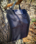 Survival Off Road Tool Kit With 19 in 1 Folding Shovel Camping Axe Multitool Pickaxe And Carrying Bag hanging on tree