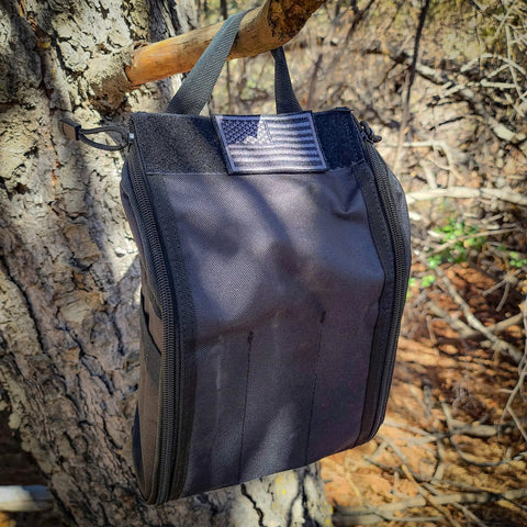 Survival Off Road Tool Kit With 19 in 1 Folding Shovel Camping Axe Multitool Pickaxe And Carrying Bag hanging on tree
