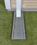 Heavy Duty Two Pack Premium Rubber Downspout Splash Blocks Built Damn Tough With A Slick Stone Texture For Top Shelf Yard Drainage And Clean Rainwater Management In Gray positioned under gutter outlet on grass.