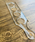 Ultra Clear Acrylic Flight Paddle Template For Woodworking Router Jigs And Home Bar Trays Featuring Hella Accurate Cutouts and Awesome Craft Beer Vibes That Make Your Setup Look Absolutely Rad on wooden surface