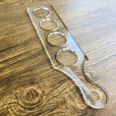 Ultra Clear Acrylic Flight Paddle Template For Woodworking Router Jigs And Home Bar Trays Featuring Hella Accurate Cutouts and Awesome Craft Beer Vibes That Make Your Setup Look Absolutely Rad on wooden surface