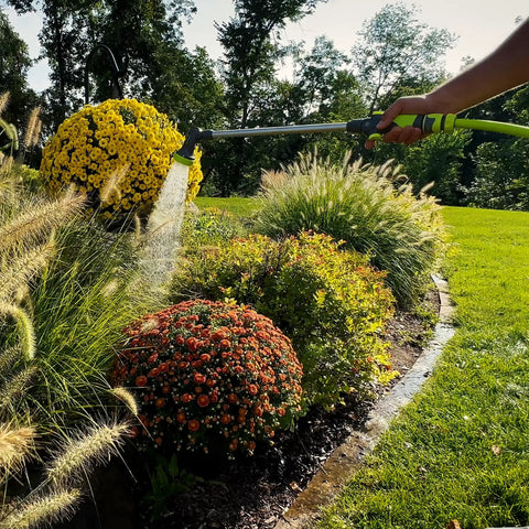 Garden Nozzle With 28 Inch Watering Wand, 3 Pattern Adjustable Sprays Jet Mist Shower in use on garden plants