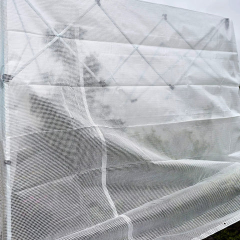 HydraTarp Clear Greenhouse Tarp 18 Ft By 24 Ft Heavy Duty 11 Mil With 3x3 Mesh Weave, shown covering a metal frame outdoors