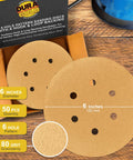 Premium 80 Grit Gold Sandpaper Discs 6 Inch With 6 Hole Dustless Hook And Loop Backing for DA Sander Box of 50 displayed