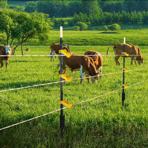 25 Pack Tube Post Insulators For Electric Fence T Post Extender Insulators Universal Fit For Round Pipe Or White Vinyl Picket Fence Keeps Wire Three And A Half Inches From Posts Non Slip Grip Yellow on fence in field with cows