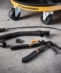 Cable Hose Clamp Pliers For Hard To Reach Clamps with snaking cable on garage floor, automotive tool visible
