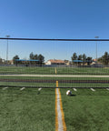 24 X 8 Foot Regulation Soccer Goal With Weatherproof Net And Heavy Duty Powder Coated Galvanized Steel Frame on a sports field.