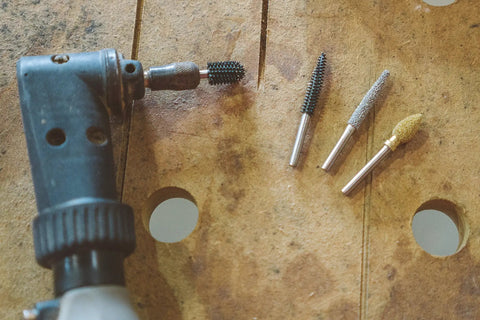 Flame Rotary Burr For Wood Carving Pro Grade With One Eighth Inch Shaft Fine Tungsten Carbide Bit shown next to tools