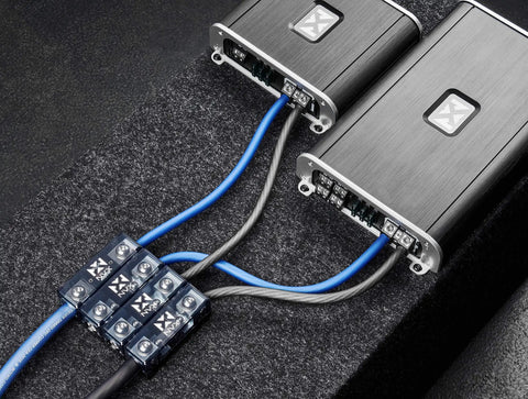 1/0 To 4 Gauge ANL Inline Fuse Block With Linkable Modular Design For Car And Marine Audio ANL Fuse Holder Built Beefy With Brass Construction And High Temp Housing For Ultimate Power Distribution installed with blue and black cables