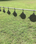 AR500 Steel Target Stand Brackets Mounts For One Inch Pipe Or Three Quarter Inch EMT Conduit Two Pack shown on grassy field