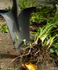 Beast Of A Compact Steel Garden Spade With Serrated Blade And Inverted V Tip For Root Removal in action on garden soil