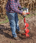 Person using 10 Inch Diameter 36 Inch Long Earth Auger With Fishtail Point And Flex Coil Shock Spring for tough soil drilling