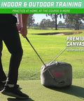 Golfer practicing with Golf Swing Impact Bag Trainer to Fix Slices and Hooks, Improve Ball Striking and Clubface Alignment outdoors.