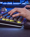 Premium Gaming Keyboard With Clicky Cherry Mx Blue Switches And Dope Rgb Backlighting showing hands typing on aluminum frame with wrist rest.