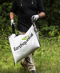 Person carrying a dock and lock debris bag for Heavy Duty 301cc Chipper Shredder With 4 Cycle Viper Engine.
