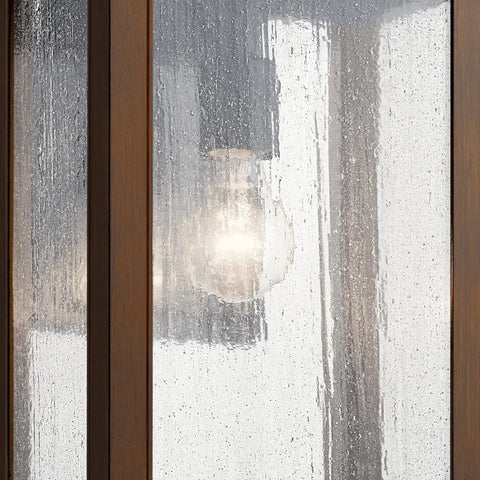 Outdoor Wall Light Sconce In A Sleek Dope Black Finish With Clear Seeded Glass, 17 Inches High By 10 Inches Wide close-up view