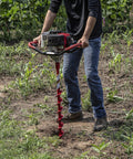 Man using 36 Inch Long Auger With Fishtail Point For Easy Upright Drilling In Dirt And Soil, Rugged Steel Build, Powder Coat Finish