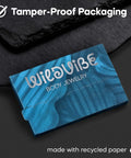Tamper-proof packaging box for WildVibe body jewelry, in blue with a swirl design, made with recycled paper.