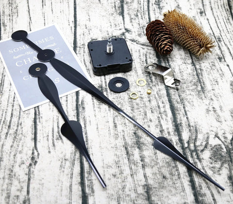 Beefy High Torque Clock Movement Kit With Long Shaft And 12 Inch Spade Hands, Two Hooks Included, clock parts on wood surface