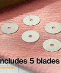 5 pack of 45mm Rotary Cutter Replacement Blades on textured pink fabric for precise cutting in sewing projects.