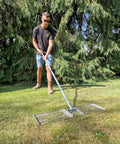 Person using 38 Inch Wide Leveling Lawn Rake With Stainless Steel Head And 72 Inch Aluminum Handle Top Notch Heavy Duty Yard Leveler
