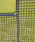 Close-up of 6Ft Black L Screen For Baseball And Softball Batting Practice With UV Treated Net And Steel Frame in a grassy field
