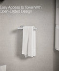 Parallel Towel Arm Bathroom Mount For Easy No Fuss Towel Access Wall Mount Towel Holder For Hand Towels Coordinating With The Parallel Collection Modern Chrome Finish Durable Steel Construction Simple Install Sleek And Functional with a towel hanging on it