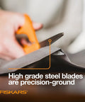 Person using Orange Handle Stainless Steel Scissors For All Purpose Cutting Ergonomic Design Sharp Blades For Office Crafts Paper Fabric And DIY Projects And More Everyday Creative Tasks on fabric