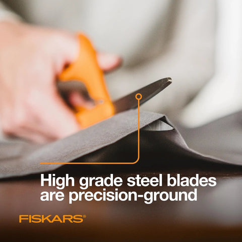 Person using Orange Handle Stainless Steel Scissors For All Purpose Cutting Ergonomic Design Sharp Blades For Office Crafts Paper Fabric And DIY Projects And More Everyday Creative Tasks on fabric