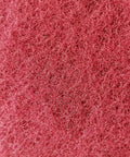 Close-up of red scrub pad from Drill Powered Tile Scrubber Kit With 4 Inch Disc Pad Holder And Six Scrub Pads, Two Stiffness Levels.