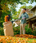 Person using Gator Grabber Telescoping Leaf Cleanup Tool With Adjustable Handle Powder Coated Steel Shafts And Heavy Duty Poly Fiber Jaws