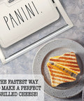 Panini Maker 750W 2 Slice Grill With Indicator Lights, open design showing grilled sandwich, creamy nonstick surface, essential kitchen appliance
