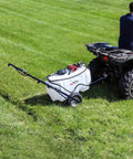 25 Gallon Trailer Sprayer With 2.4 GPM Pump And 3 Nozzle Boom Delivers High Pressure Lawn And Garden Coverage attached to ATV