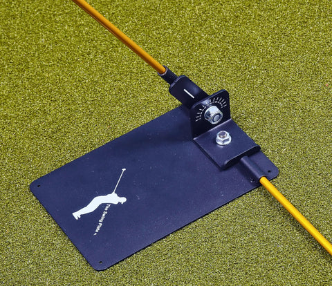 Pro Grade Golf Swing Trainer Plate With 2 Premium Gold Alignment Rods, Swing Analyzer Aid on green surface for precise alignment