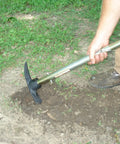 Person using Handle All Multi Purpose Tool Workhorse With Telescoping Handle And Full Size Shovel Sledge Hammer Axe And Pick Heads on dirt