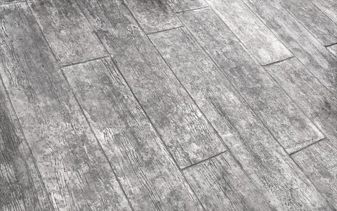Close-up of Centennial Plank Concrete Stamp Set With Vintage Wood Slab Texture Mats on surface showing realistic lumber detail