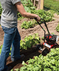 Person using Cultivator With 43Cc 2 Cycle Viper Engine 6 To 10 Inch Adjustable Width 8 Inch Maximum Depth in garden