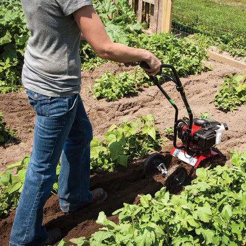Person using Cultivator With 43Cc 2 Cycle Viper Engine 6 To 10 Inch Adjustable Width 8 Inch Maximum Depth in garden