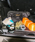 Universal Winch Accessory Kit with Tree Trunk Protector 4x20 Feet, Snatch Block 30,000 Lb Capacity, gloves, and trail bag in car trunk