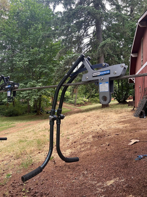 Side view of Zip Line Trolley With Brake Featuring The Real Deal Patent No Wear Braking System installed on zip line.