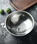 Top view of stainless steel strainer from Three Piece Wide Mouth And Regular Mouth Canning Funnel Set for Mason jars on kitchen counter