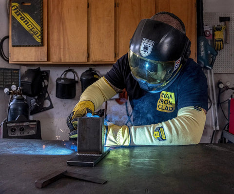 Heavy Duty Eighteen Inch Kevlar Arm Sleeves Featuring Legit A3 Cut Resistant Armor and Heat Proof Double Layer Weave, worn during welding.