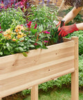 Person tending plants in Two Piece Raised Garden Bed Set With Legged Planter Boxes, 48x24x30in Elevated Wooden Horticulture Beds for Backyard