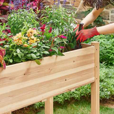 Person tending plants in Two Piece Raised Garden Bed Set With Legged Planter Boxes, 48x24x30in Elevated Wooden Horticulture Beds for Backyard